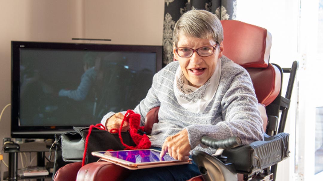 Lady in wheel chair at specialist disability care facility