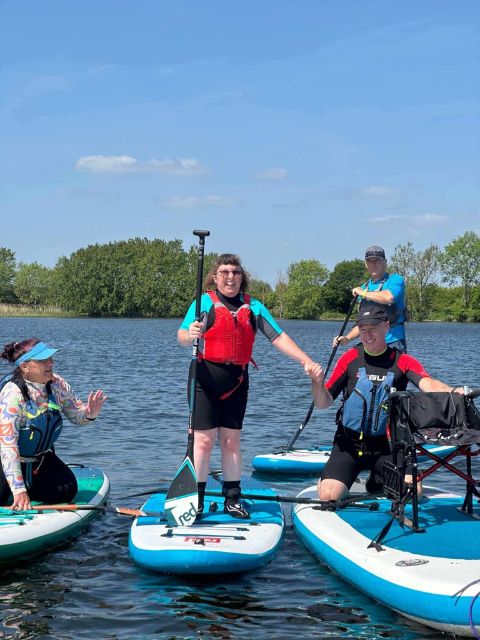 A photograph of a person we support paddle boarding 
